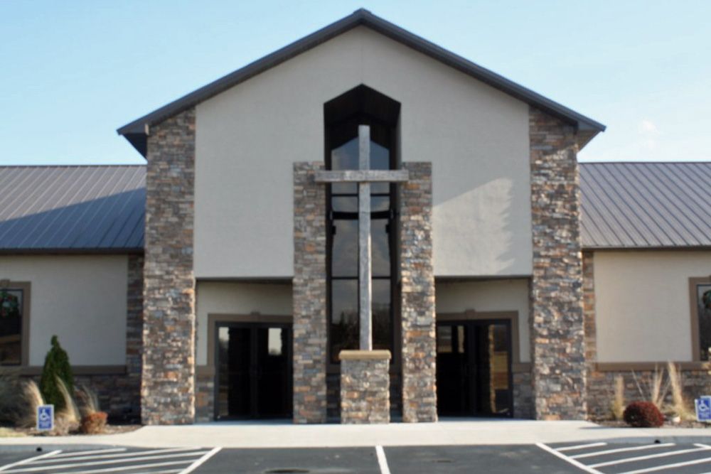 A church with a cross on the front of it